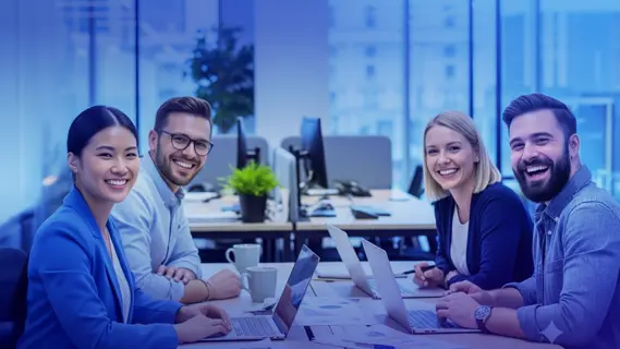 Embedded Finance for Employees, happy team working on a desk.